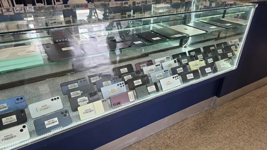 Phone display case with tablets and laptops